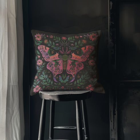 A beautifully detailed pillowcase cover featuring a vibrant moth in shades of pink, purple, and green. The moth is framed by intricate floral designs, including lush green leaves and pink flowers, all set against a dark, moody background. The design evokes a cottagecore aesthetic with gothic undertones, blending nature with a magical, whimsical vibe.